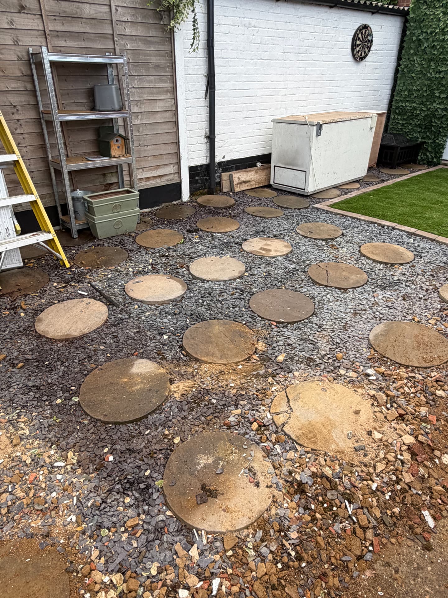 The same Essex garden after the garage was removed, swept gravel and stepping stones remaining